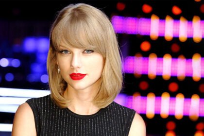 Speculation around 'Is Taylor Swift a Christian?' as she appears thoughtful on the red carpet.